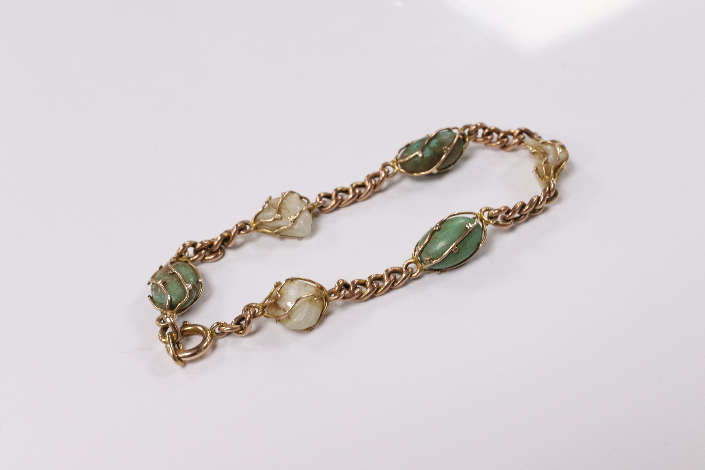 An early 20th century yellow metal, turquoise and baroque pearl set curb link bracelet, 18cm, gross weight 11.1 grams. Condition - fair